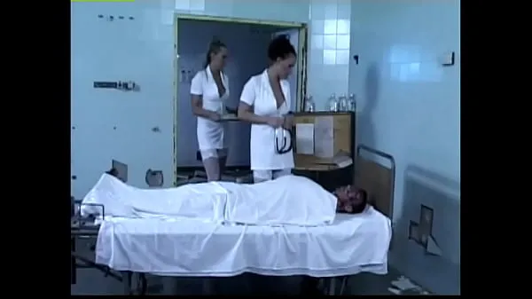 HD Two horny nurses play with a patient's cock power Clips